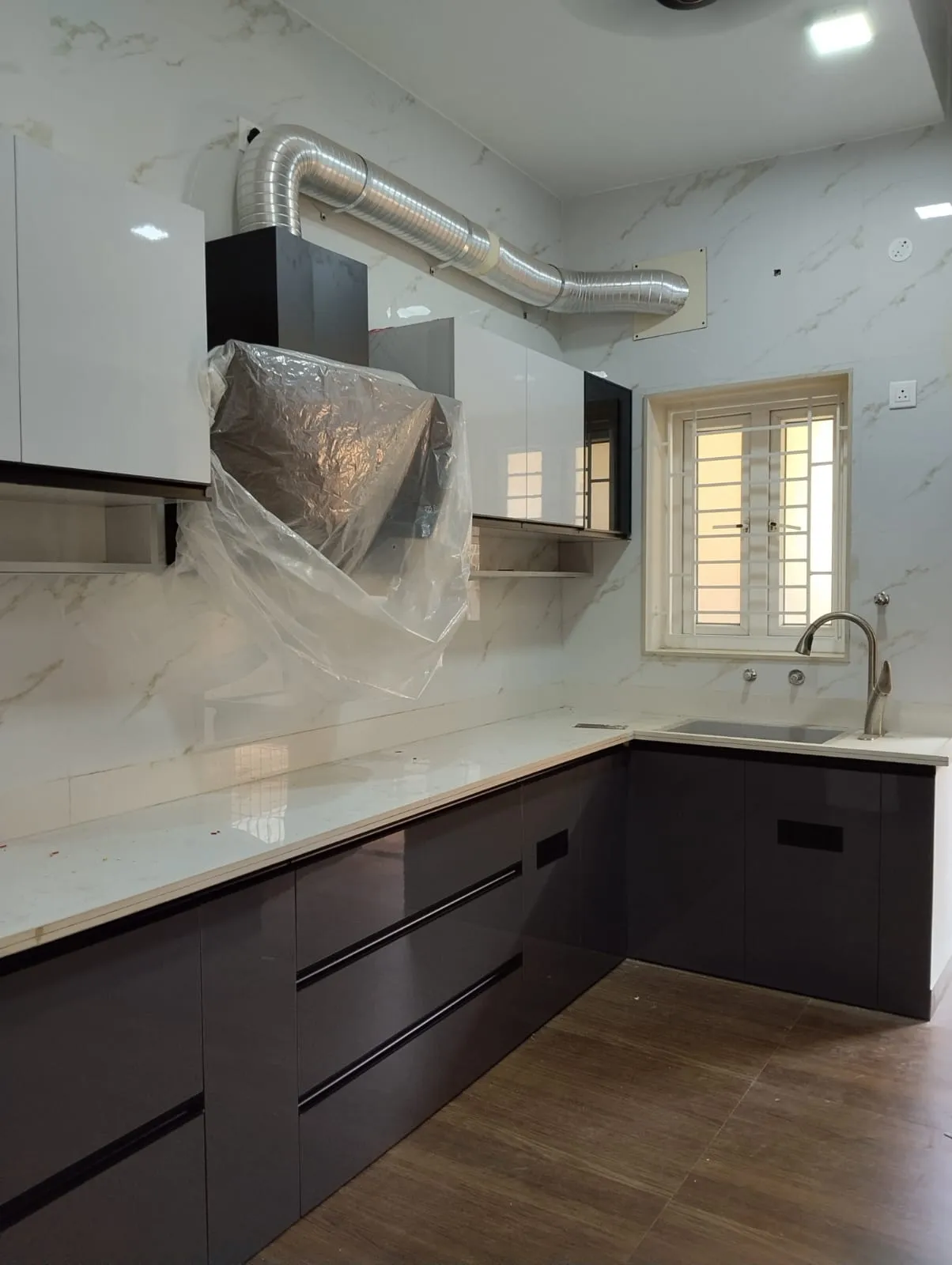 Contemporary L-Shaped Modular Kitchen High-Gloss Charcoal Base with Crisp White Wall Cabinets Base Cabinets Desk and Decor 