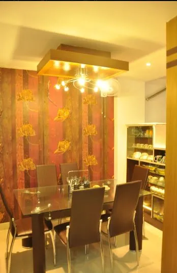 Dining Room with Leaf-Pattern Wallpaper and Box Ceiling Chandelier Open Dining with Living Desk and Decor 