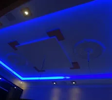 Geometric False Ceiling with Orange Beam Accents Architectural False Ceiling & Lighting Desk and Decor 
