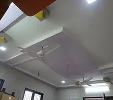 Geometric False Ceiling with Orange Beam Accents Architectural False Ceiling & Lighting Desk and Decor 