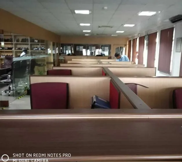 Commercial Office Reception & Workstation Area Cabin-Based Office Layout Desk and Decor 