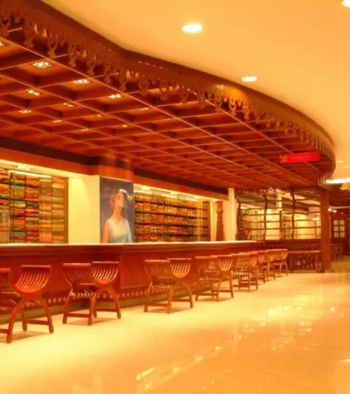 Traditional Wooden False Ceiling with Display Counter – Saree Showroom Interior Saree/Textile Showroom Display Unit Desk and Decor 