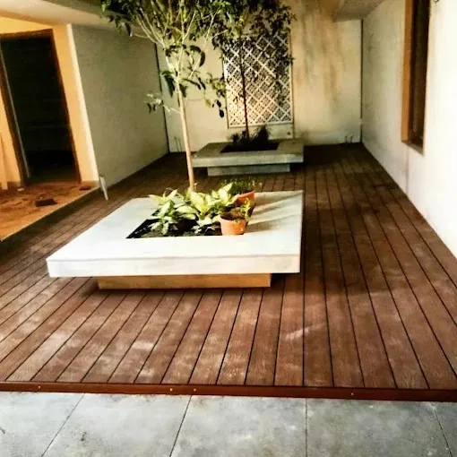 covered outdoor sit-out / semi-open patio corridor Courtyard Spaces Desk and Decor 