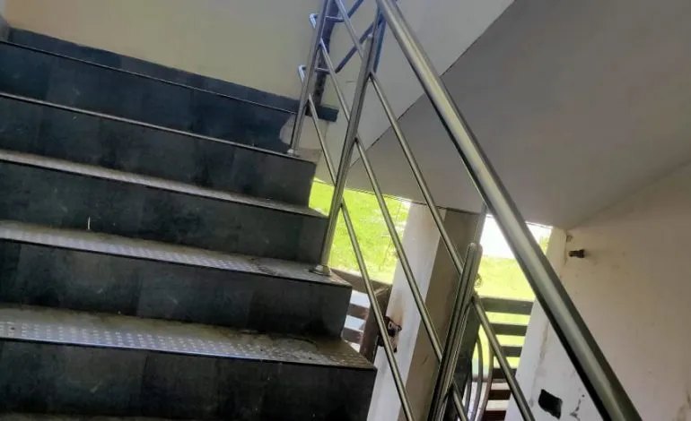 Spiral Staircase with Wooden Treads & Metal Railing (Under Construction) Modern Staircase Desk and Decor 