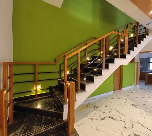 Wooden Handrail Dog-Legged Staircase with Black Marble Treads Staircase Design Desk and Decor 