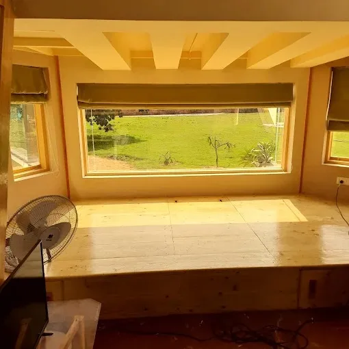 Raised Wooden Platform Seating with Coffered Ceiling & Bay Window Wall Paneling Desk and Decor 