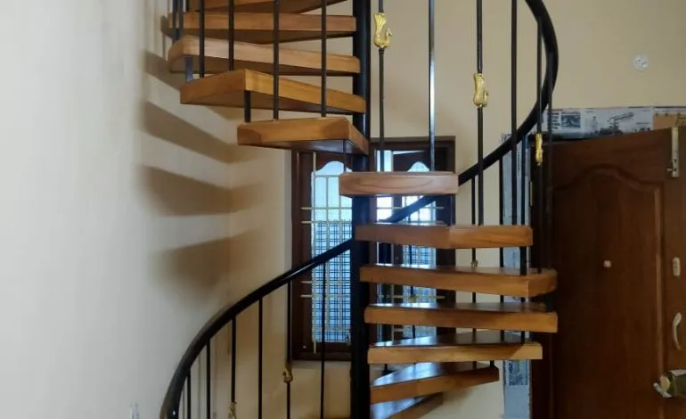 Spiral Staircase with Wooden Treads & Metal Railing (Under Construction) Modern Staircase Desk and Decor 
