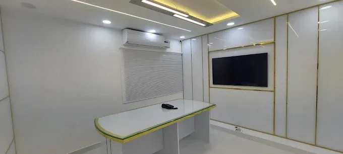Minimalist White Office Cabin with Gold Trim Paneling Cabin-Based Office Layout Desk and Decor 