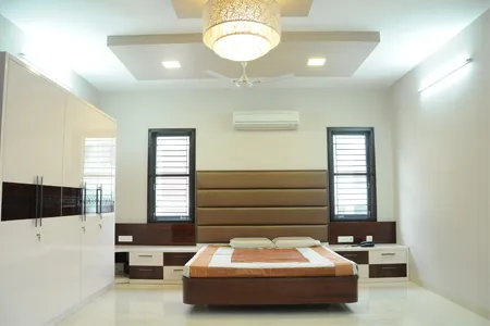 Bedroom with Channel-Tufted Headboard & Twin Window Symmetry Modern Bedroom Desk and Decor 