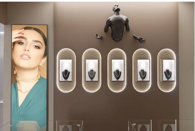 Jewelry Showroom Display Wall with Sculptural Feature & Backlit Niches with Premium Showcase Units at Deskanddecor
