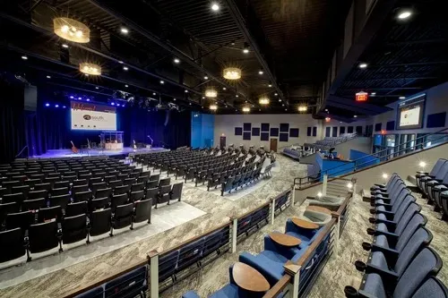 Large Auditorium/Event Hall with Tiered Theatre Seating with Auditorium/Event Hall Design at Deskanddecor