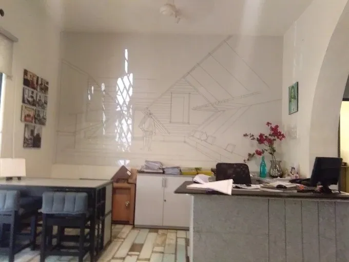 Small Office Room with Sketch Wall Art & Reception Counter with Modern Office Designs at Deskanddecor