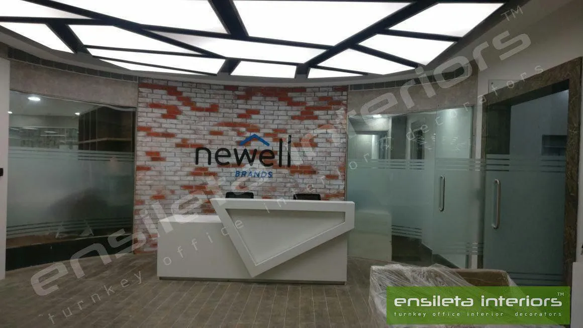 Rustic Brick-Accent Branding Wall with Geometric Minimalist Desk with Reception Desks at Deskanddecor