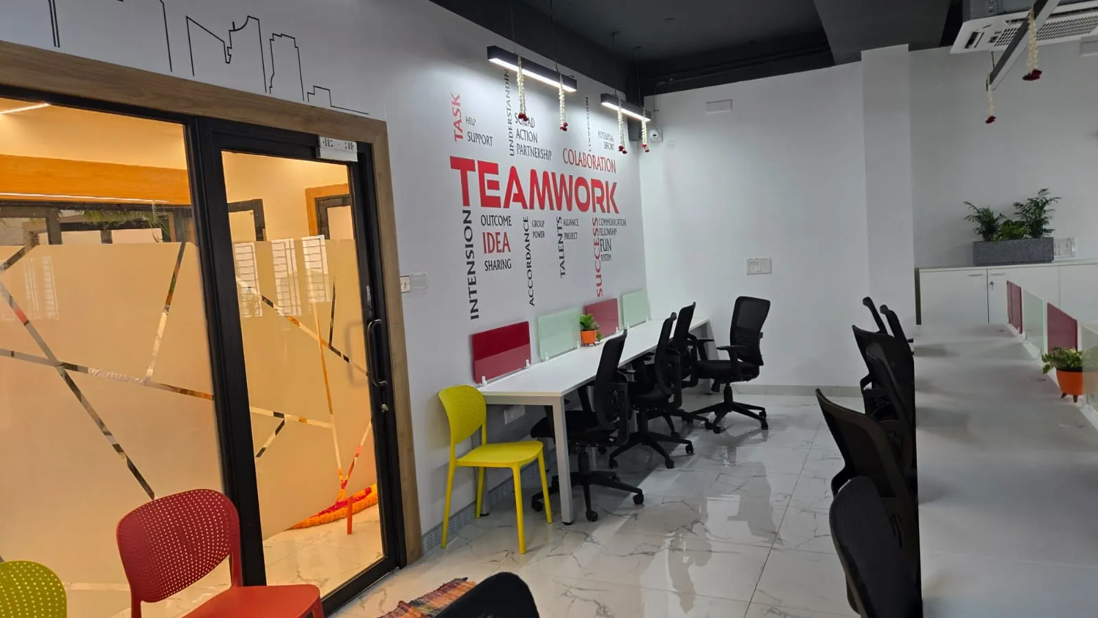 'Teamwork' Branded Feature Wall and Collaborative Workstation Zone with Executive Desks at Deskanddecor