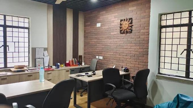 Modern Executive Office with Exposed Brick Accent Wall with Corporate Office Layouts at Deskanddecor