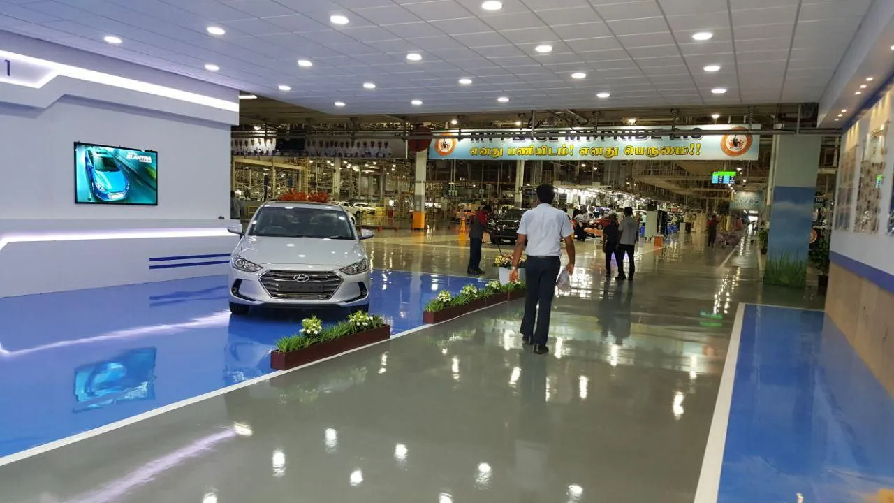 'Assembly-1' Corporate Branding Wall with LED Ambient Lighting and Reflective Epoxy Flooring with Feature Display Units at Deskanddecor