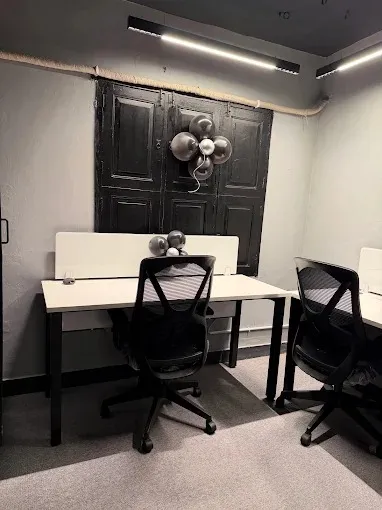 Minimalist Office Nook with Vintage Black Door Accent Wal with Modern Office Designs at Deskanddecor