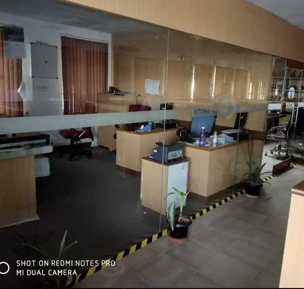Commercial Office Reception & Workstation Area with Cabin-Based Office Layout at Deskanddecor