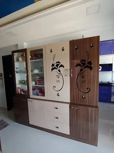 Combination TV & Pooja Unit with Ganesha Motif Cabinets with Loft Storage Designs at Deskanddecor
