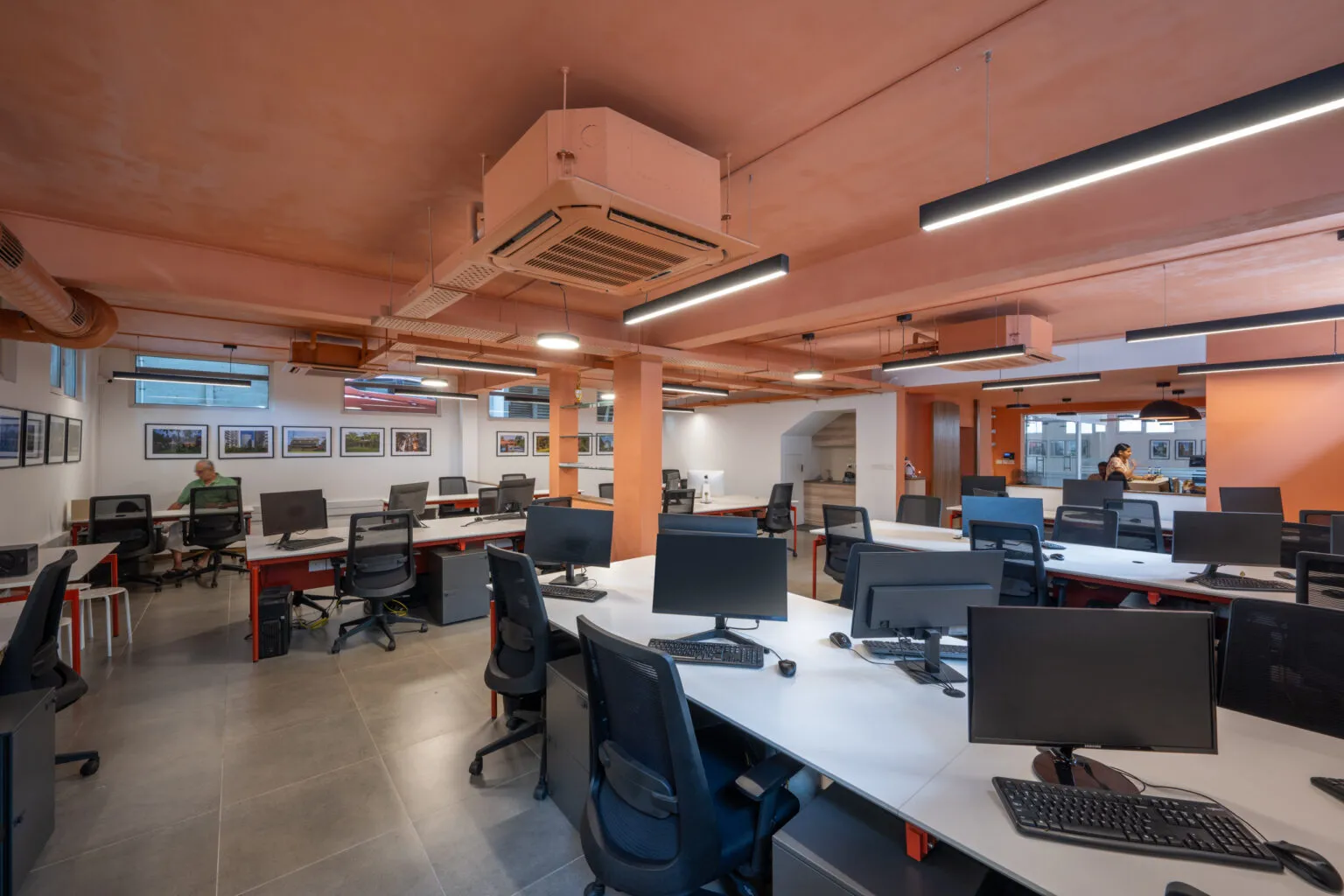 Industrial-Style Open Office Workspace with Exposed Ceiling with Modern Office Designs at Deskanddecor