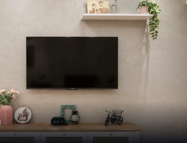 Minimalist Living Room TV Unit with Texture Finish Wall with TV Unit Focused Design at Deskanddecor
