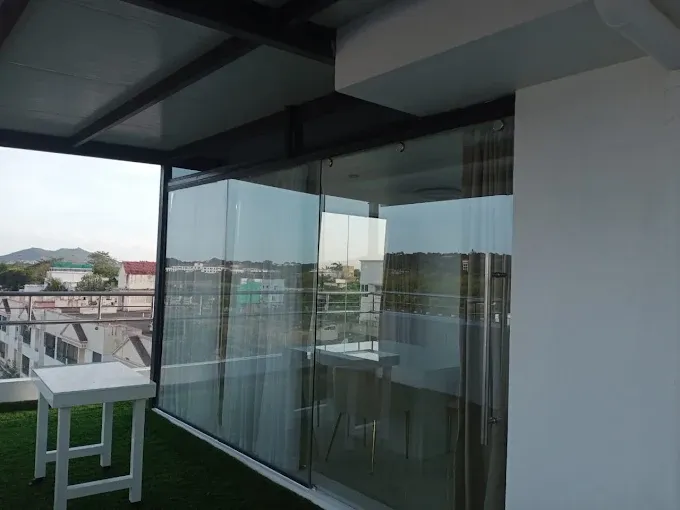 Contemporary Open-Air Balcony Lounge with Outdoor Chairs at Deskanddecor
